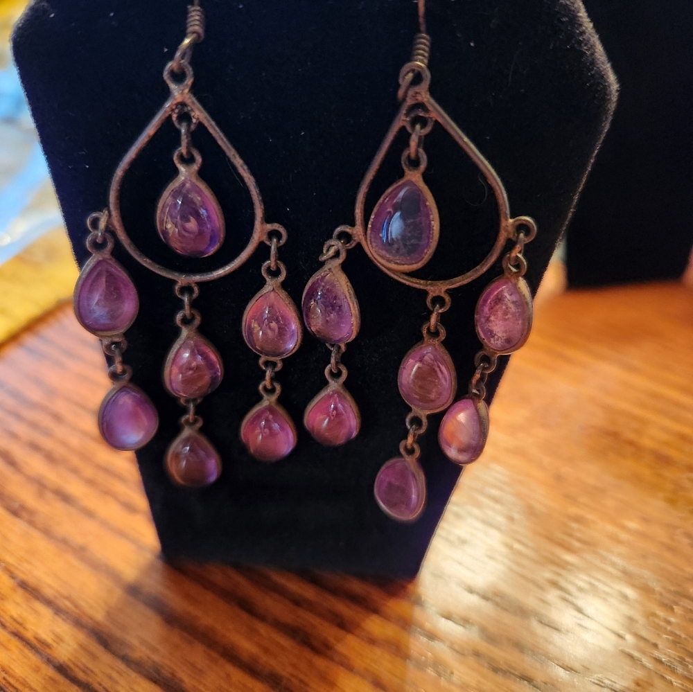 Pretty chandelier type earrings with purple beads.